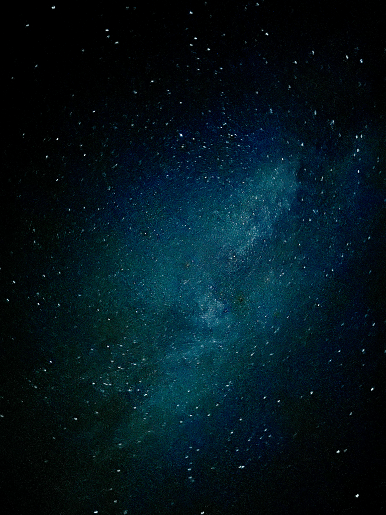 Detailed Milky Way core with glowing star clouds in a dark sky.