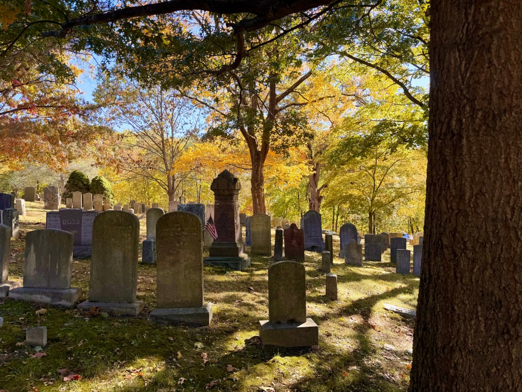 A collection of 18th and 19th century gravestones in Sleepy Hollow Cemetery - adjacent to the Old Dutch Church burial grounds in autumn in Sleepy Hollow, NY.