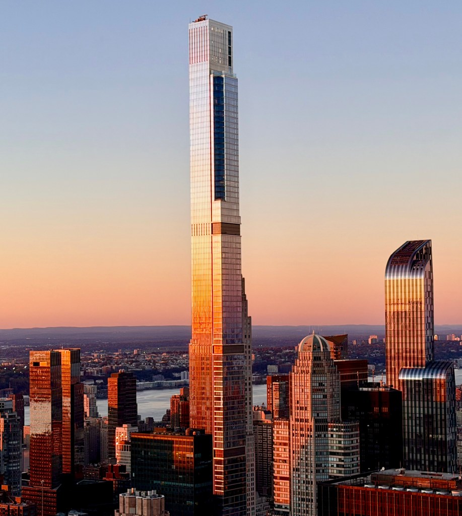 The Steinway Tower on West 57th Street, Manhattan - reflecting the sunset with Hudson River and New Jersey in background.